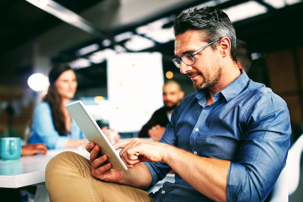 man-reading-tablet